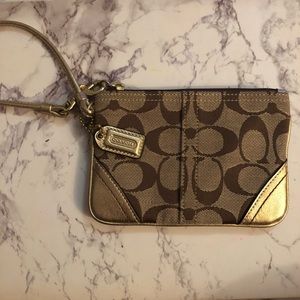 Coach wristlet. Gold and tan